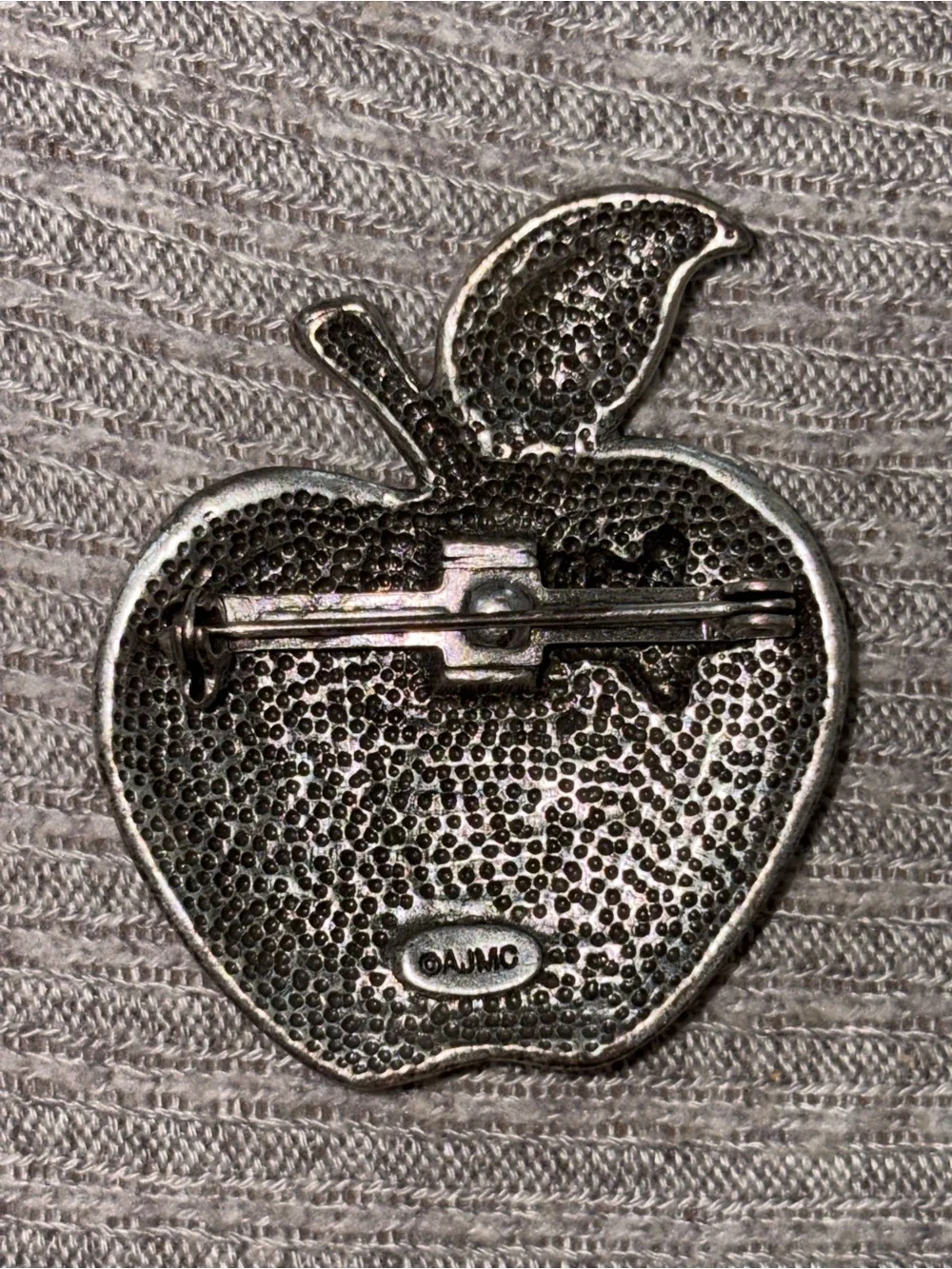 Vintage AJMC marked silver tone American flag apple brooch